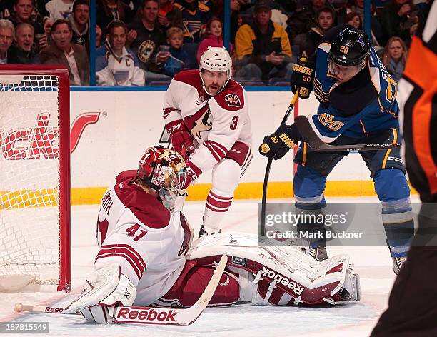 Alexander Steen of the St. Louis Blues tries to shoot past goalie Mike Smith of the Phoenix Coyotes on November 12, 2013 at Scottrade Center in St....