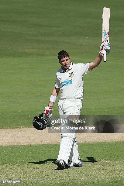 Marcus North of the Warriors celebrates reaching 100 runs during day one of the Sheffield Shield match between the Redbacks and the Warriors at...