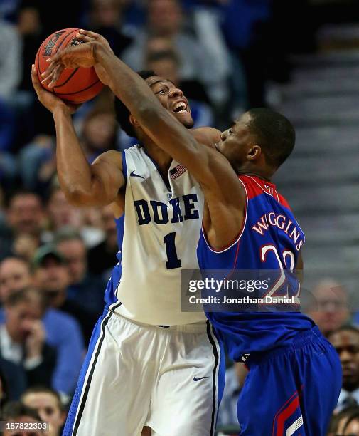 Jabari Parker of the Duke Blue Devils tries to shoot against Andrew Wiggins of the Kansas Jayhawks during the State Farm Champions Classic at the...