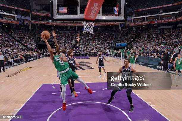 Derrick White of the Boston Celtics drives to the basket during the game against the Sacramento Kings on December 20, 2023 at Golden 1 Center in...