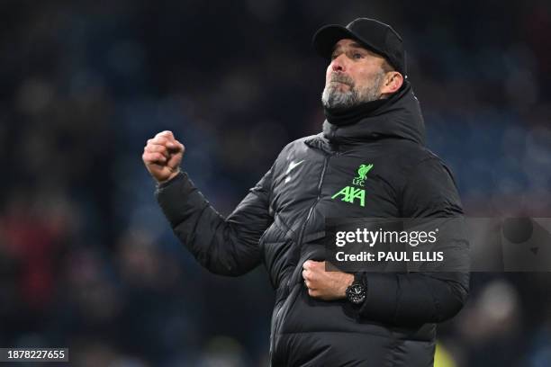 Liverpool's German manager Jurgen Klopp celebrates on the pitch after the English Premier League football match between Burnley and Liverpool at Turf...
