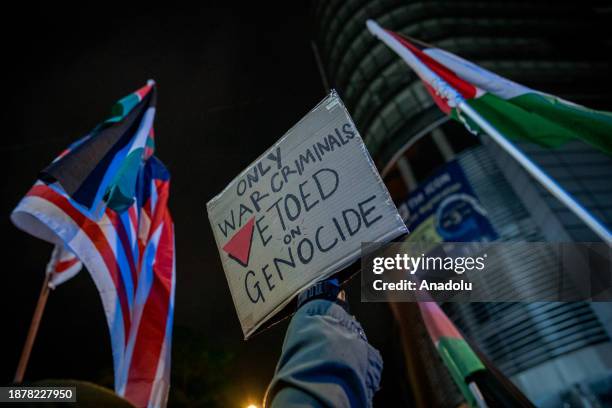 Demonstrators holding banners and Palestinian flags gather near the United States embassy in solidarity with Palestinian people during the 'Kepung...