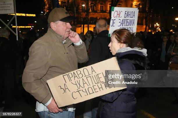 Citizens stage a protest outside the central election commission building to protest election results in Belgrade, Serbia on December 26, 2023.