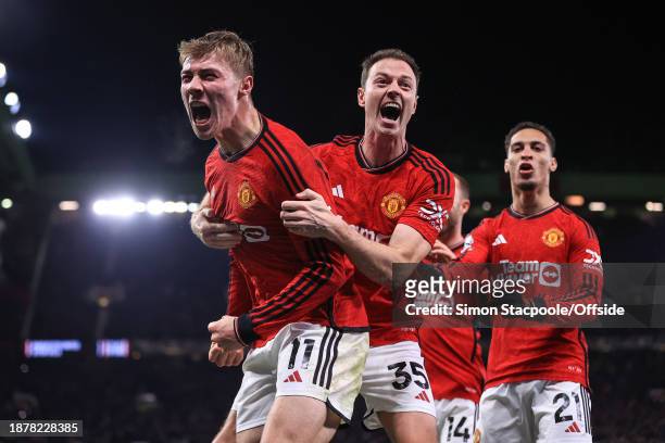Rasmus Hojlund of Manchester United celebrates scoring their 3rd and winning goal with Jonny Evans during the Premier League match between Manchester...