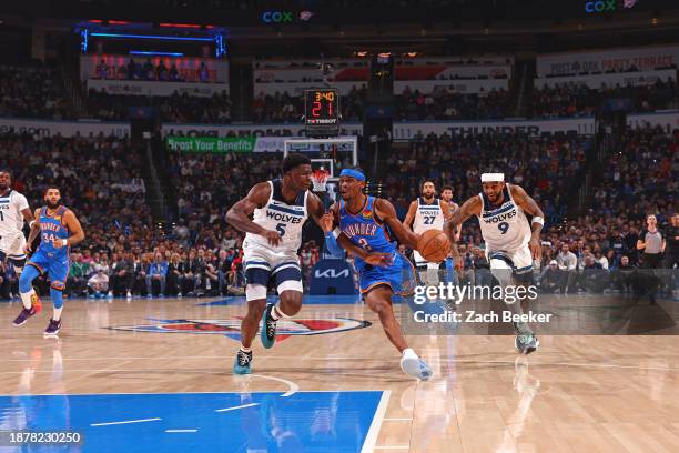 Shai Gilgeous-Alexander of the Oklahoma City Thunder dribbles the ball during the game against the Minnesota Timberwolves on December 26, 2023 at...