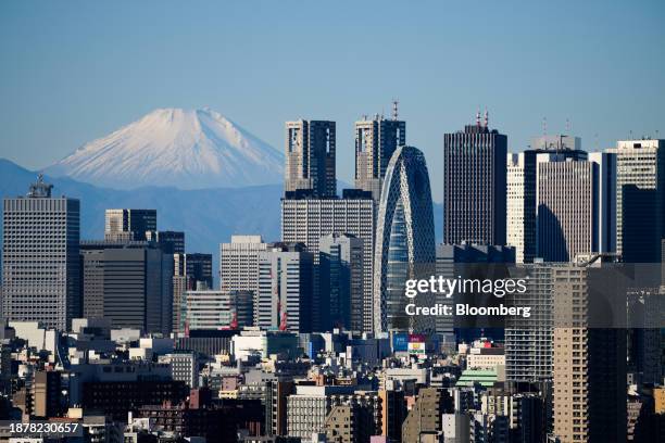 Mount Fuji and the Shinjuku skyline seen from an observation deck in Tokyo, Japan, on Tuesday, Dec. 26, 2023. Japan's industrial output in November...