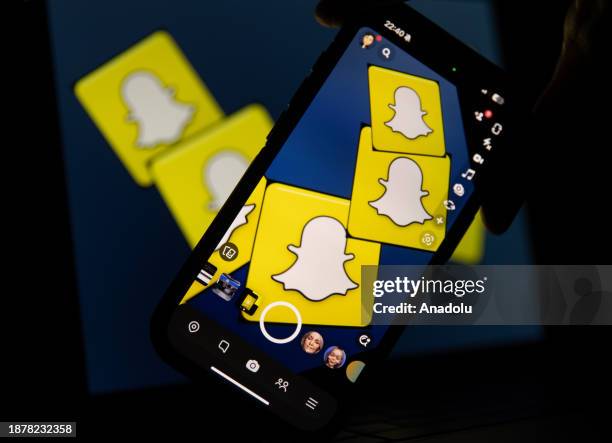 In this photo illustration, logo of Snapchat displayed on a mobile phone screen and computer screen in Ankara, Turkiye on December 26, 2023.