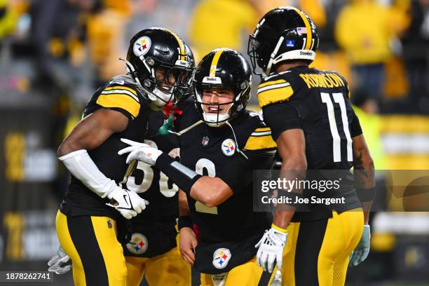 George Pickens of the Pittsburgh Steelers celebrates after scoring a touchdown with his teammates Mason Rudolph and Allen Robinson II during the...