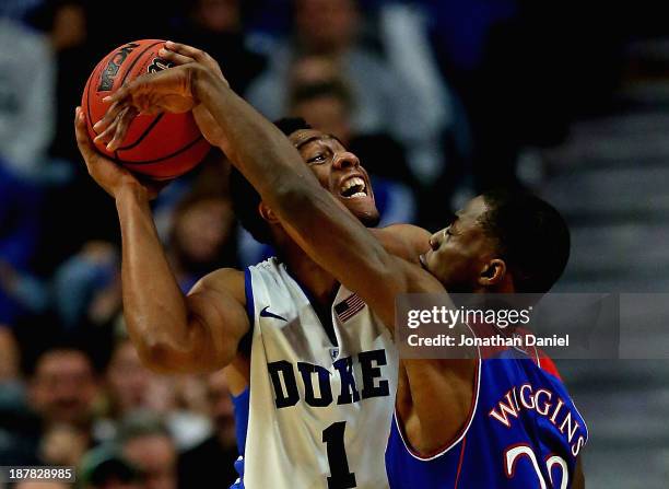 Jabari Parker of the Duke Blue Devils tries to shoot against Andrew Wiggins of the Kansas Jayhawks during the State Farm Champions Classic at the...