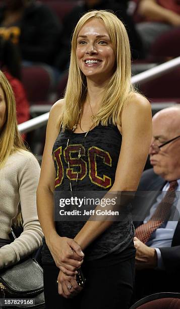 Model Amanda Enfield smiles as she stands at her seat before the home opening game between the Cal State Northridge Matadors and the USC Trojans at...
