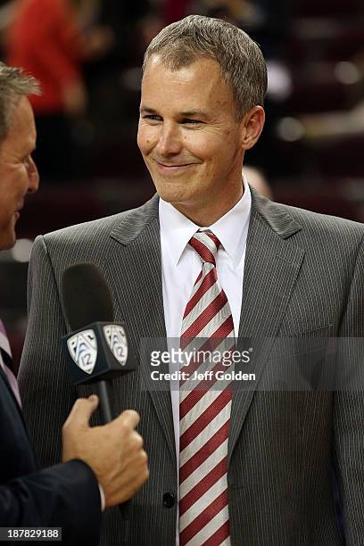 First year head coach Andy Enfield of the USC Trojans smiles as he is interviewed on the Pac-12 Network after getting his first win at USC in the...