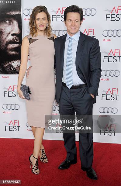 Actor Mark Wahlberg and wife Rhea Durham arrive at the AFI FEST 2013 for the "Lone Survivor" premiere at TCL Chinese Theatre on November 12, 2013 in...