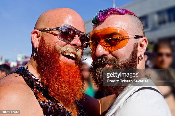 Colorful gay couple at the Folsom Street Fair. The Folsom Street Fair is an annual BDSM and leather subculture street fair held on the last Sunday in...