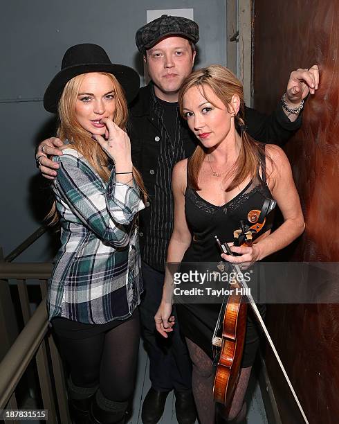 Actress Lindsay Lohan, musician Jason Isbell, and violinist Amanda Shires attend Dylan Fest NYC 2013>> at the Bowery Ballroom on November 12, 2013 in...