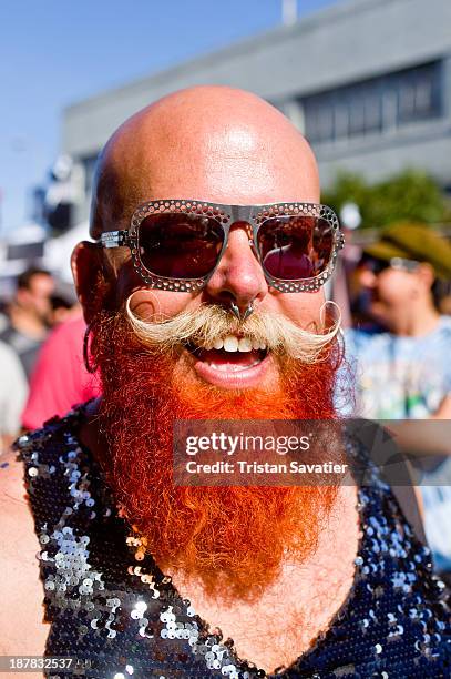 San Francisco photographer Dusti Cunningham with his signature sunglasses and red beard, spotted at the Folsom Street Fair. Other keywords: man,...