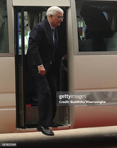 Indian Foreign Minister Salman Khurshidgets daown from bus as arrives to attend the Commonwealth Foreign Ministers meeting on November 13, 2013 in...