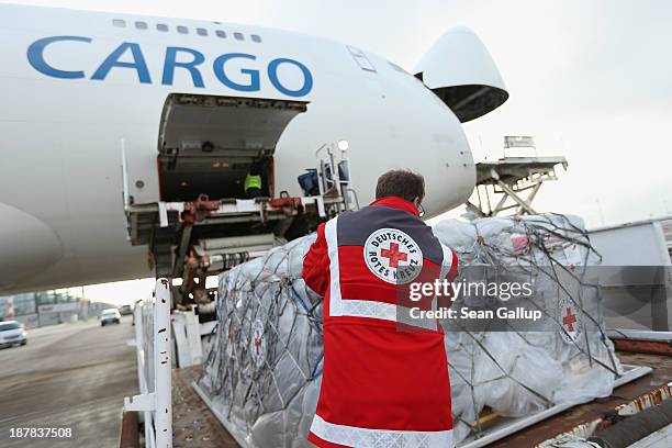 Member of the German Red Cross checks a shipment of aid destined for the Philippines at Schoenefeld Airport on November 13, 2013 in Schoenefeld,...