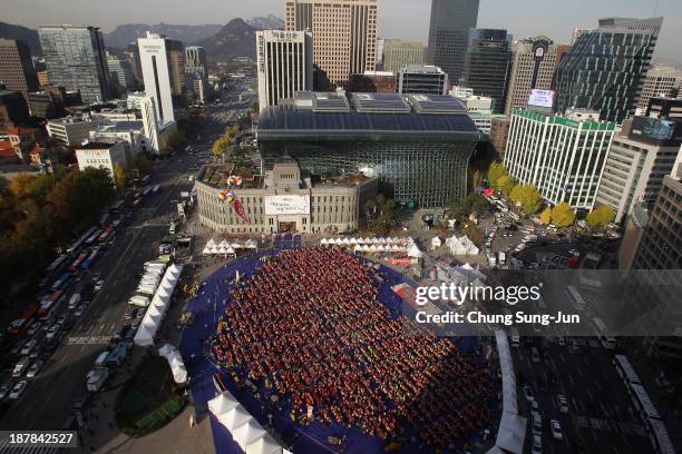 More than three thousand housewives make Kimchi for the poor in preparation for winter at the City Hall of Seoul on November 13, 2013 in Seoul, South...