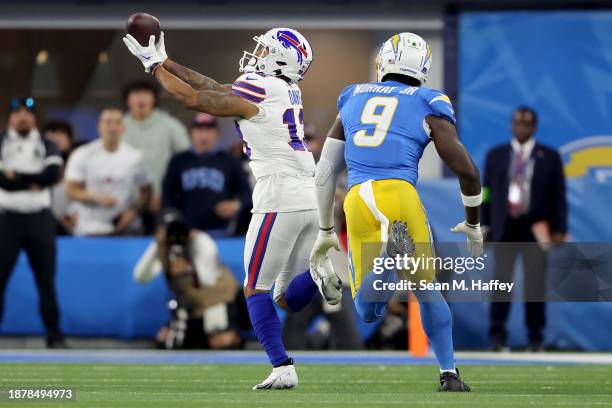 Gabe Davis of the Buffalo Bills makes a catch past Kenneth Murray Jr. #9 of the Los Angeles Chargers in the second quarter at SoFi Stadium on...