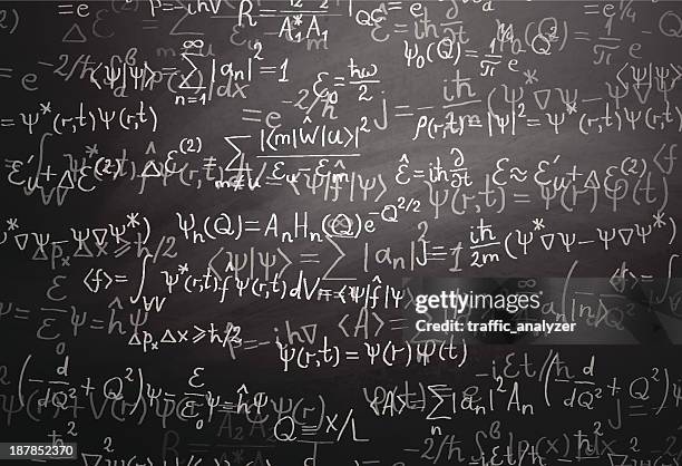 quantum physics formulas over blackboard - physics equation stock illustrations