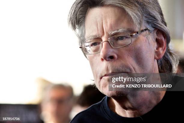 American author Stephen King poses for photographers on November 13, 2013 in Paris, before a book signing event dedicated to the release of his new...