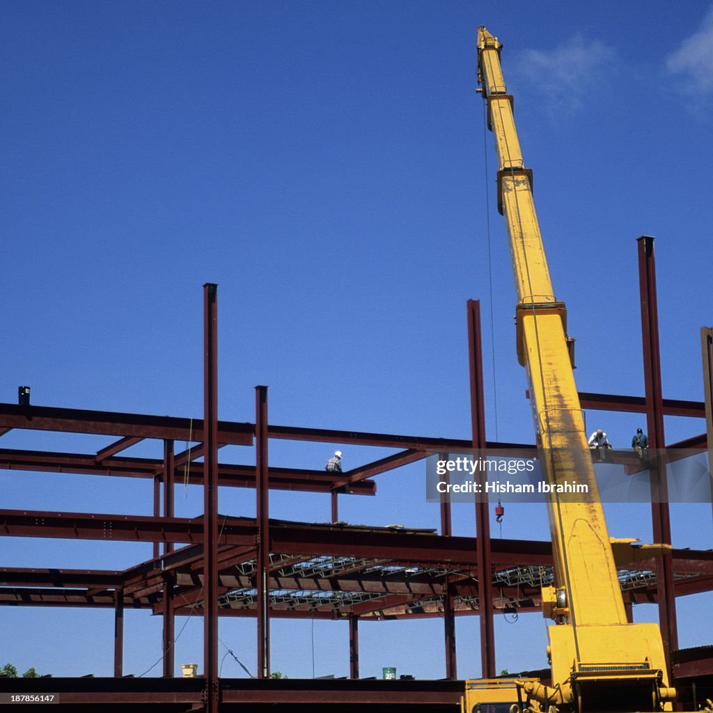 Construction site with girders and crane