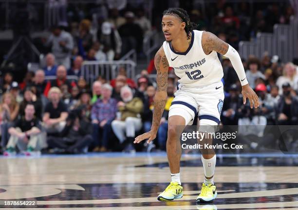 Ja Morant of the Memphis Grizzlies reacts after shooting over Trae Young of the Atlanta Hawks during the fourth quarter at State Farm Arena on...