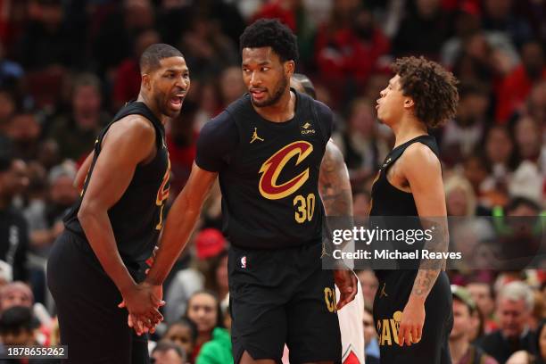 Damian Jones of the Cleveland Cavaliers celebrates with Tristan Thompson and Craig Porter after a basket against the Chicago Bulls during the second...