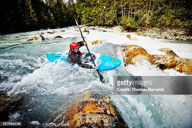 kayaker entering white water rapids - kayak stock pictures, royalty-free photos & images