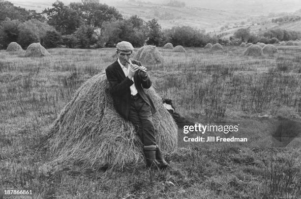 Pat Phildy plays his penny whistle in a field in Tawnylea, County Leitrim, Ireland, circa 1974.