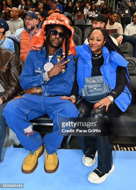 Rapper 2 Chainz and Kesha Epps attend the game between Memphis Grizzlies and the Atlanta Hawks at State Farm Arena on December 23, 2023 in Atlanta,...