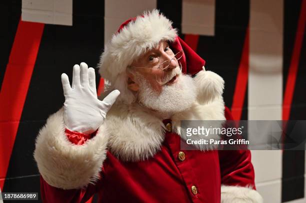 Santa Claus attends the game between the Memphis Grizzles and the Atlanta Hawks at State Farm Arena on December 23, 2023 in Atlanta, Georgia. NOTE TO...