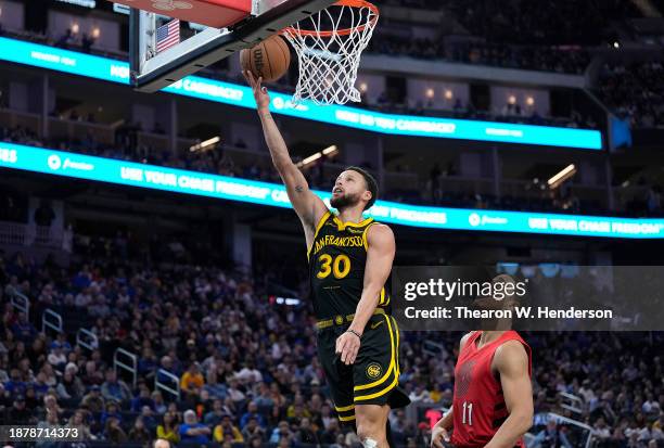 Stephen Curry of the Golden State Warriors goes in for a layup against the Portland Trail Blazers during the second half at Chase Center on December...