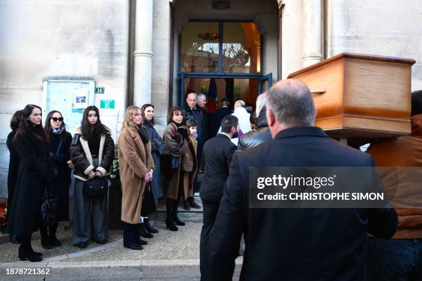 Guy Marchand's former wife Beatrice Chatelier , Guy Marchand's wife Adelina Khamaganova-Marchand and relatives attend the funeral of French actor,...