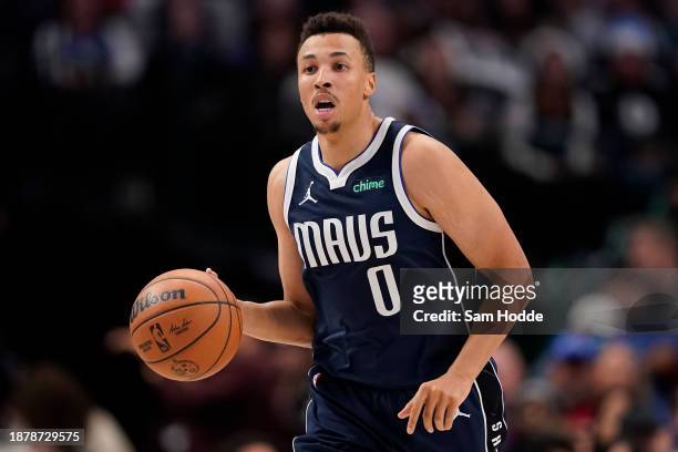 Dante Exum of the Dallas Mavericks brings the ball up court during the second half against the San Antonio Spurs at American Airlines Center on...