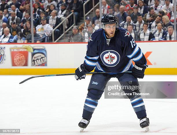 Matt Halischuk of the Winnipeg Jets looks on during a first period stoppage against the Chicago Blackhawks at the MTS Centre on November 2, 2013 in...