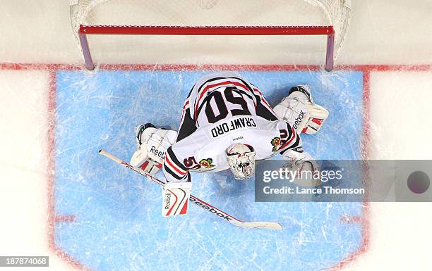 Goaltender Corey Crawford of the Chicago Blackhawks gets set in the crease during third period action against the Winnipeg Jets at the MTS Centre on...