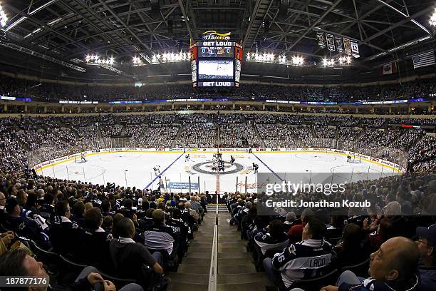 The Winnipeg Jets and the Chicago Blackhawks get set for the opening face-off in front of a sold-out crowd of 15,004 at the MTS Centre on November 2,...
