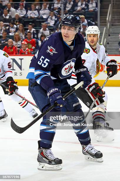 Mark Scheifele of the Winnipeg Jets keeps an eye on the play during third period action against the Chicago Blackhawks at the MTS Centre on November...