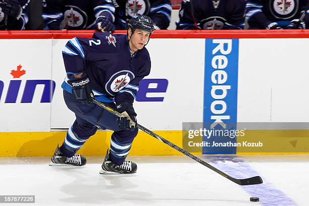 Adam Pardy of the Winnipeg Jets carries the puck up the ice during first period action against the Chicago Blackhawks at the MTS Centre on November...