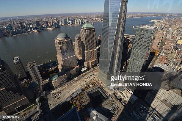 Lower Manhattan, including the World Trade Center Memorial in this view from the 68th floor of newly opened 4 World Trade Center November 13, 2013 in...