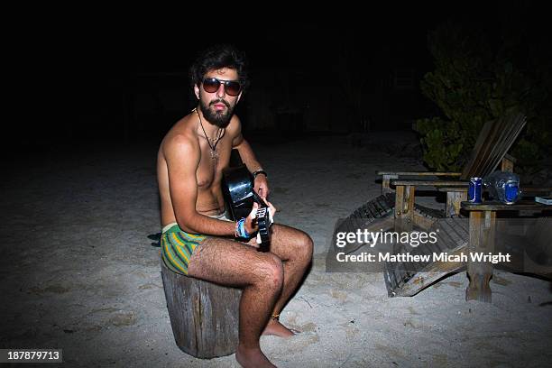 a funny man playing music in underwear - beach volleyball night stock pictures, royalty-free photos & images