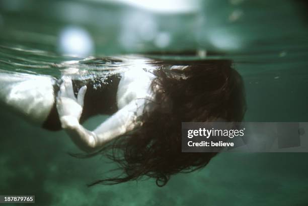 drown together - brown hair stock pictures, royalty-free photos & images