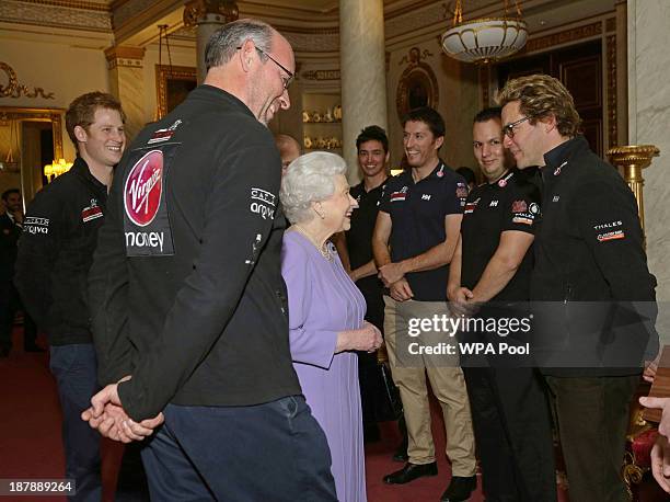 Queen Elizabeth II talks to Dominic West , Team Ambassador of Team Commonwealth, as Ed Parker , co-Founder of Walking with the Wounded and Prince...