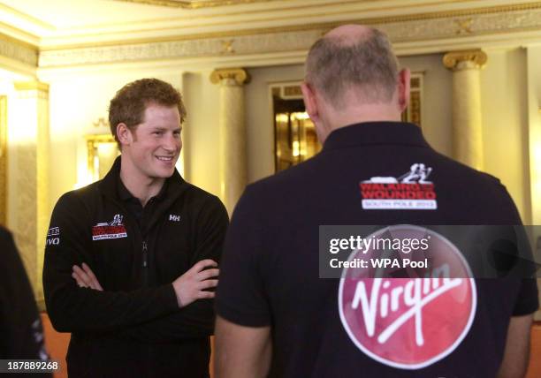 Prince Harry meets members of Team Commonwealth during a reception to meet the three teams of wounded servicemen and women from the United Kingdom,...