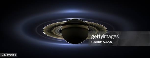 In this handout from NASA, the planet Saturn is seen backlit by the sun, sent Cassini spacecraft July 19, 2013 in space. NASA unvieled the image,...