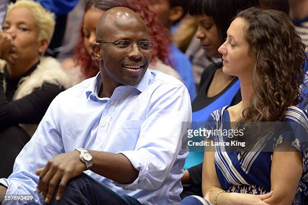 Former personal assistant to U.S. President Barack Obama and Duke basketball and football player, Reggie Love , looks on during a game between the...