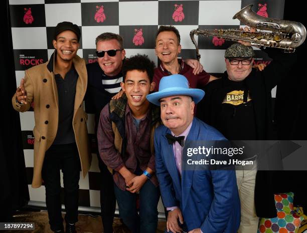 Graham "Suggs" McPherson, Daniel "Woody" Woodgate, Chris "Chrissy Boy" Foreman and Lee "Kix" Thompson of Madness pose with Harley Alexander-Sule and...