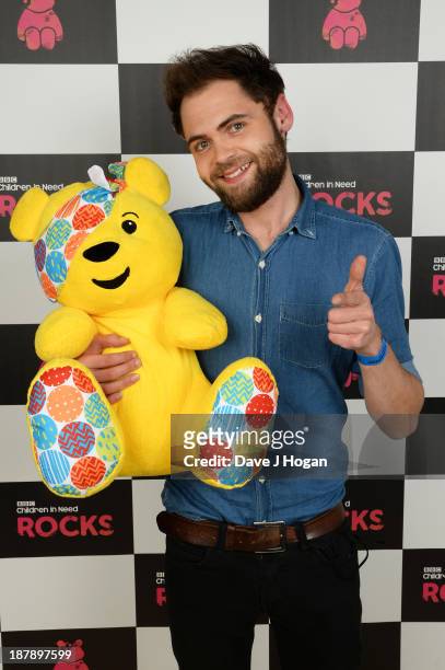 Michael Rosenberg of Passenger poses with Pudsey Bear backstage during the 'BBC Children In Need Rocks' at Hammersmith Eventim on November 13, 2013...