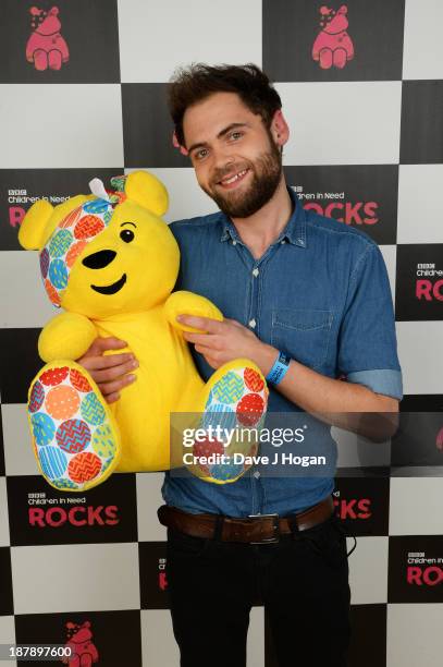 Michael Rosenberg of Passenger poses with Pudsey Bear backstage during the 'BBC Children In Need Rocks' at Hammersmith Eventim on November 13, 2013...